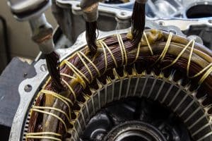 Stator of an IPM-SynRM (Internal Permanent Magnet Synchronous Reluctance Motor) motor of an moder electric vehicle. EV maintenance, service; repair concept;